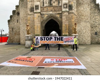 Southampton, UK - 31th March 2021: A Group Of Protesters Hold Up A Banner Outside Of The Southampton Bargate,. The Banner Reads Stop The Explotation, Amazon Stop Union Busting, Action On Amazon. 