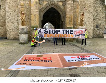 Southampton, UK - 31th March 2021: A Group Of Protesters Hold Up A Banner Outside Of The Southampton Bargate,. The Banner Reads Stop The Explotation, Amazon Stop Union Busting, Action On Amazon.