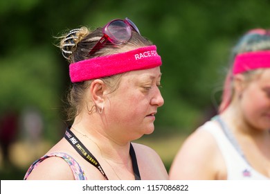 SOUTHAMPTON, UK - July 1 2018: Race For Life, Women Run And Walk To Raise Money For Cancer Research Charity, In Southampton UK. Woman Looking Sweaty With Sweat Band On Head, Tired After Finishing Race