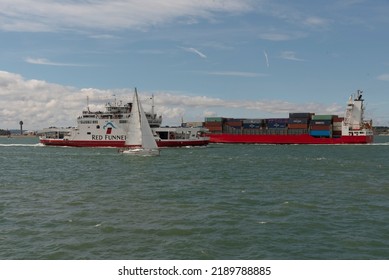 Southampton Water, Southern England, UK. A Selection Of Vessels Alongside, An Isle Of Wight  Ferry, Sailing Boat, Container Carrier Approaching The Solent. UK