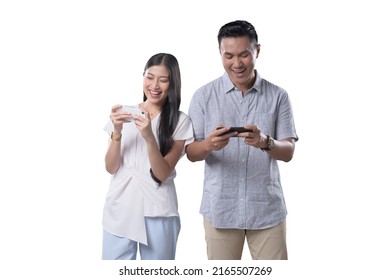 Southeast Asian Couple Playing Games With Mobile Phone