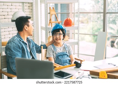 Southeast Asian Family Father And Son Diy Activity Together At Home Concept. Boy Talking Of Carpenter Or Engineer Dad Job With Parent At Workshop Office.