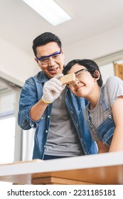 Southeast asian family father and son diy or repair at home concept. Dad teach using tools about carpenter or engineer education skill with child at workshop. - Shutterstock ID 2231185181
