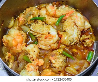 Southeast Asian, Myanmar Or Burmese Favorite Oily Shrimp Or Prawn Curry With Sliced Green Chilies And Onions Recipe. Closeup View.