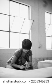 Southeast Asian Woman Making Pottery In A Pottery Studio