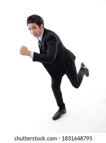 Southeast Asian Young Office Business Man Wearing Suit Running At Camera On White Studio Background