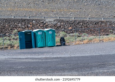 Southeastern Washington, USA - May 2, 2021: Portable Bathrooms Are Lined Up At A Parking Lot 