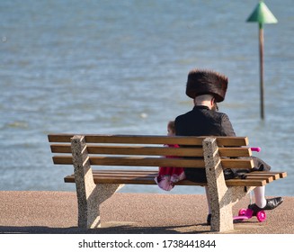 Southend-on-Sea, Essex, England, 04-10-2020: Jewish Dressed Gentleman With Girl During Lockdown In Southend-on-Sea 