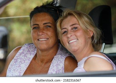 Southend-on-Sea, UK  July 17th 2022 Two Ladies Smile At The Camera. Mother And Daughter Sitting In A Car, Smiling On A Sunny Day. Focus On Older Woman.