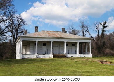a southern abandoned rundown old rural plantation estate house empty house landscape