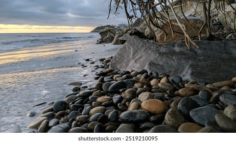 Southern California coastal scenery with waves, beaches, sunsets, silhouettes, tide pools, surfers and palms trees with rocky shore abstracts at Swamis Reef Surf Park in Encinitas Ca. - Powered by Shutterstock