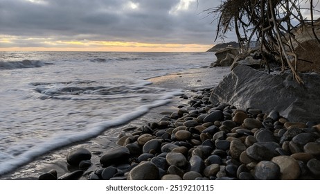 Southern California coastal scenery with waves, beaches, sunsets, silhouettes, tide pools, surfers and palms trees with rocky shore abstracts at Swamis Reef Surf Park in Encinitas Ca. - Powered by Shutterstock