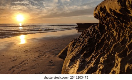 Southern California remote coastal beaches, sunset silhouettes, tide pools, surfers, ocean waves, palm trees, weathered rock abstracts and cloud formations at Swamis Reef Surf Park in Encinitas. - Powered by Shutterstock