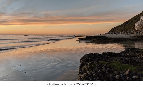 Southern California remote coastal beaches, sunset silhouettes, tide pools, surfers, ocean waves, palm trees, weathered rock abstracts and cloud formations at Swamis Reef Surf Park in Encinitas. - Powered by Shutterstock