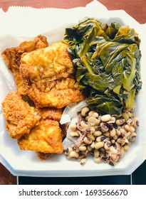 Southern Cooking. Fried Cod, Black Eyed Peas And Rice, And Collard Greens.