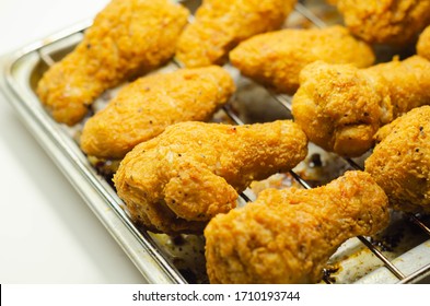 Southern crispy battered fried chicken wings, deep-fried chicken wings on the metal tray, fast food