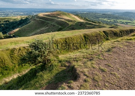 Southern end of Malvern Hills,beautiful smooth rolling hillsides,popular walking area,beautiful views across the ancient hillfort,towards rural Gloucestershire,on a sunny summer's late afternoon.