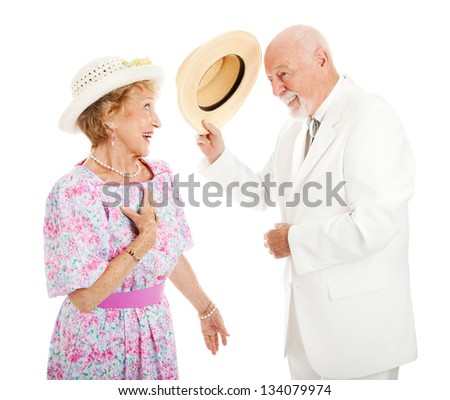 Southern gentleman tipping his hat to a pretty southern belle. Isolated on white