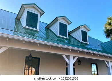 A Southern House Roof Line With 3 Gables And Green Shingles