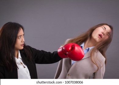 Southpaw Business Woman Beating Surprised Impact Sucker Punch To Competitor