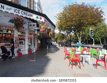 Southport, Merseyside, United Kingdom - 9 September 2020: Woman With A Pram Buying Ice Cream At Antonios Shop And Cafe In Southport Merseyside