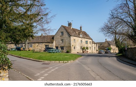 Southrop, England - March 2022: The Village Green And The Swan Public House In Southrop, The Cotswolds, England, United Kingdom