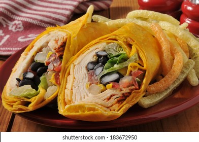 A Southwestern Chipotle Chicken Wrap Sandwich With Veggie Potato Crisps