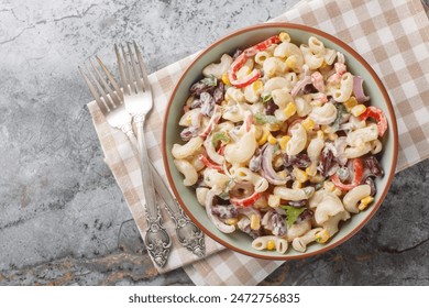 Southwestern elbow pasta salad filled with fresh veggies, red beans, and a zesty dressing close up on the bowl on the table. Horizontal top view from above
 - Powered by Shutterstock