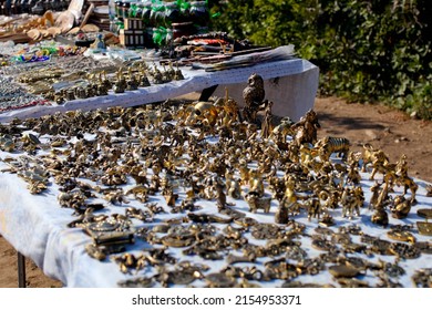 Souvenir Stall. Street Shop With Metal Figures.