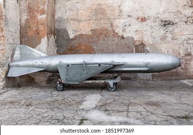 Soviet Anti Ship Missile P-15 Termit Developed In The 1950s Stands Near Grungy Wall Of Coastal Artillery Battery