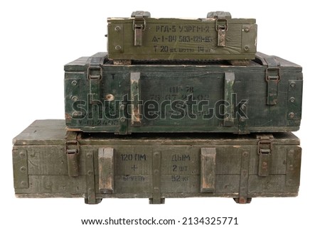 Soviet army ammunition stack of green crates. Text in russian - type of ammunition, projectile caliber, projectile type, number of pieces and weight. Isolated on white background.