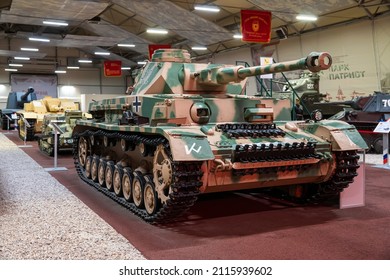 Soviet and German tanks of World War II in the tank hall at the Patriot Park Museum. Moscow, Russia December 19, 2021.