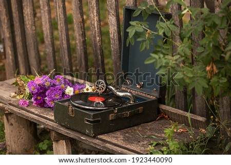 Soviet gramophone with a vinyl record of the USSR. Memorial record player. The inscription on the plate 