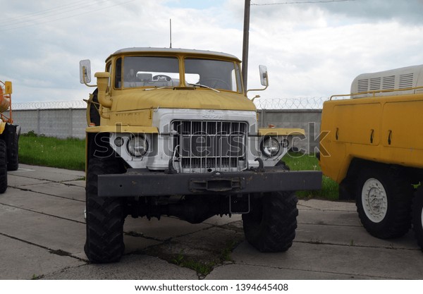 Soviet retro airport service\
trucks. Exhibit of museum of aviation . May 10, 2019.Kiev,\
Ukraine