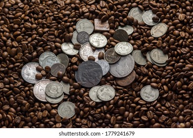 Soviet Union Coins Fall On Coffee Beans. Two Dollars In Silver. Charms And Bark Of The Mamvri Oak. Washingtonia Leaflet. Flatley. Souvenirs On A Dark Background. Brown Background