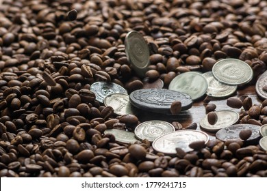 Soviet Union Coins Fall On Coffee Beans. Two Dollars In Silver. Charms And Bark Of The Mamvri Oak. Washingtonia Leaflet. Flatley. Souvenirs On A Dark Background. Brown Background