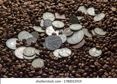 Soviet Union Coins Fall On Coffee Beans. Two Dollars In Silver. Charms And Bark Of The Mamvri Oak. Washingtonia Leaflet. Flatley. Souvenirs On A Dark Background. Brown Background