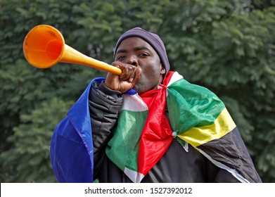  Soweto, Johannesburg South Africa June 10 2010  South African Football Fan Blowing Vuvuzela At Soccer City Stadium Just Before The Kick-off Of The 2010 FIFA World Cup In South Africa.