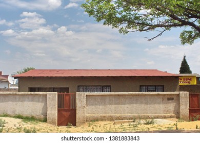 SOWETO, SOUTH AFRICA - CIRCA OCTOBER 2018: House With A Concrete Wall In The Township