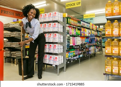 Soweto, South Africa - February 15, 2017: Grocery Store Staff Mopping Floors At Local Pick 'n Pay Spaza Shop