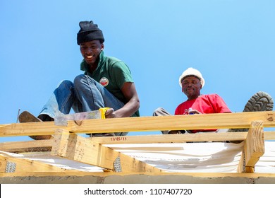 Soweto, South Africa, September 10, 2011,  Diverse Community Members Building A Low Cost House As A Team In Soweto