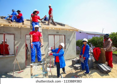 Soweto, South Africa, September 10, 2011,  Diverse Community Members Building A Low Cost House As A Team In Soweto