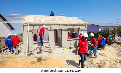 Soweto, South Africa, September 10, 2011, Diverse Community Members Join PWC's Staff In Building A Low Cost House As A Team In Soweto
