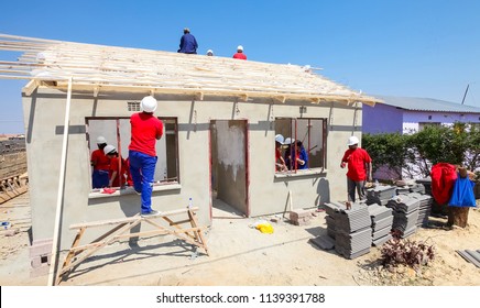 Soweto, South Africa, September 10, 2011, Diverse Community Members Join PWC's Staff In Building A Low Cost House As A Team In Soweto