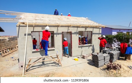 Soweto, South Africa, September 10, 2011, Diverse Community Members Join PWC's Staff In Building A Low Cost House As A Team In Soweto