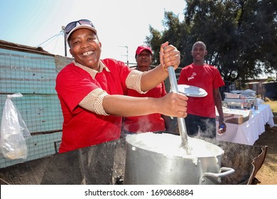 Soweto, South Africa - September 10, 2011: African Woman Cooking Mielie Pap Maize Porridge On Side Street In Urban Soweto