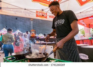 Soweto, South Africa - September 17, 2017: Diverse African vendors cooking and serving various bread based street food at outdoor festival
