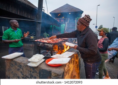 SOWETO- SOUTH AFRICA-SEPTEMBER 29, 2017: In Soweto Where Poor People Live, Roadside Steaks And Sausages Are Cooked.