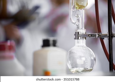 Soxhlet Extractor.Percolator-boiler and reflux.Filter paper thimble,siphon mechanism and cold water circulating.Reflux condenser,distillation flask on heating element.Organic chemistry class.Pharmacy