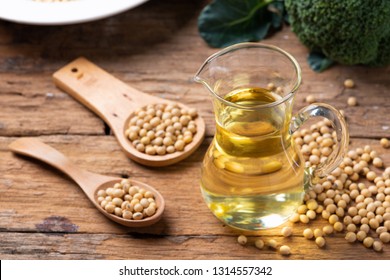 Soy Bean And Soy Oil On Wooden Table